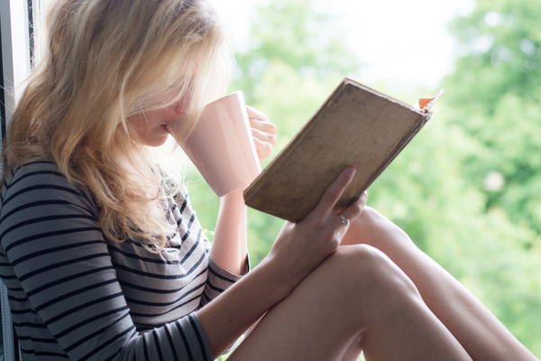 While-drinking-coffee-while-reading-girls-Stock-Photo.jpg