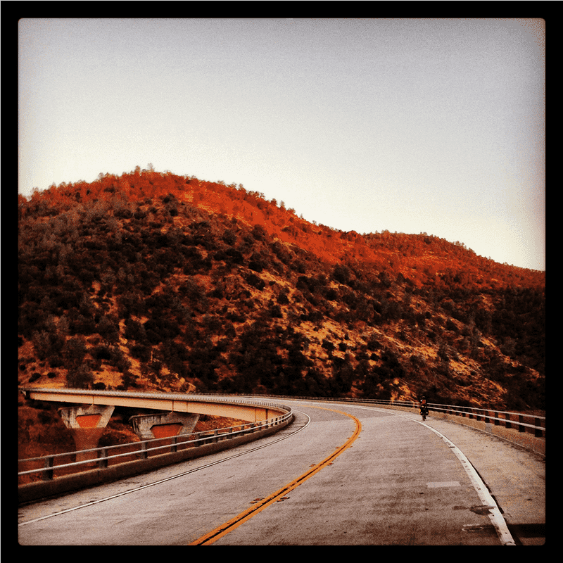 Scenic Toll Road Through Majestic Mountains PNG