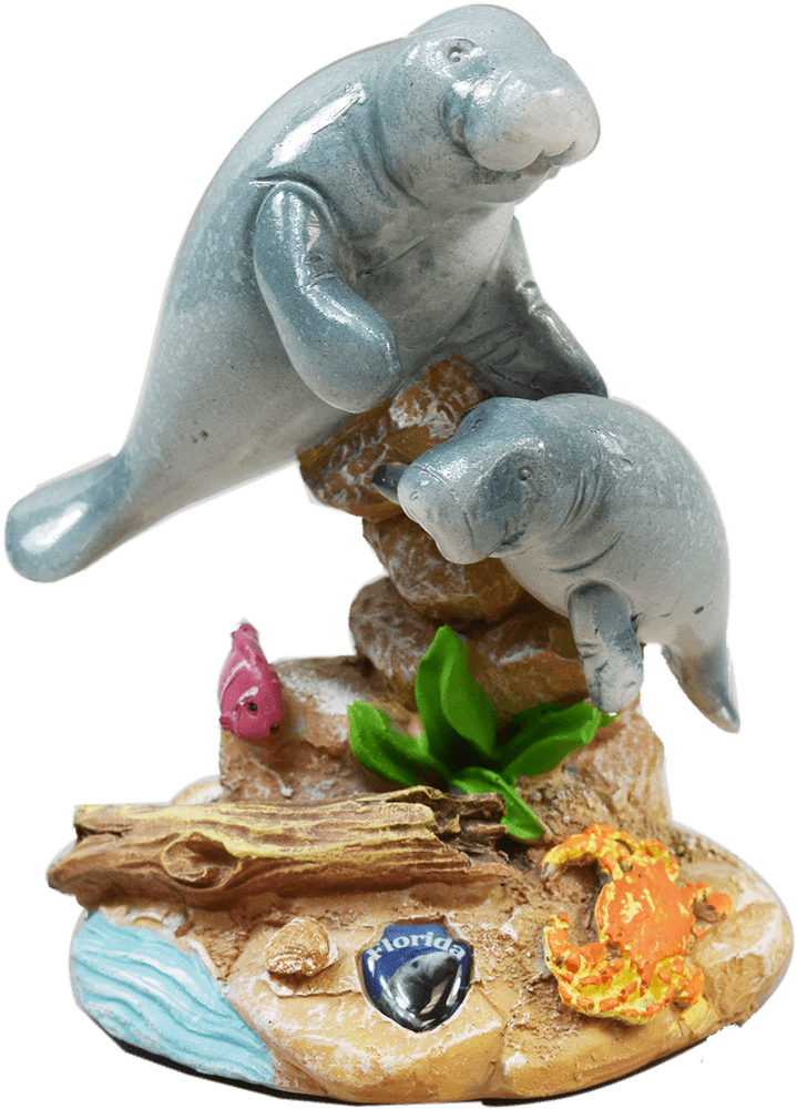 Playful Manatee Family Figurine by the Shore PNG
