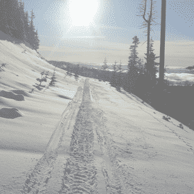 Snow-Covered Trail Under the Radiant Sun PNG