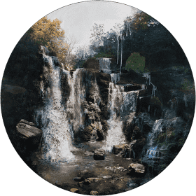 Majestic Waterfall Among Lush Greenery PNG