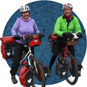 Adventurous Bicycle Touring Duo on an Epic Journey PNG
