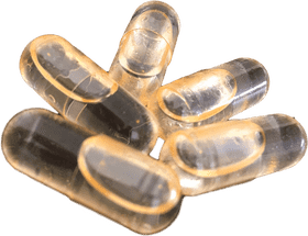 Golden Gelatin Pill Collection Display PNG