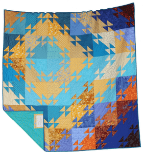 Vibrant Patchwork Quilt Blanket in Blue and Gold PNG