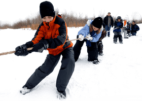 Adventurous Child Tugging in Winter Wonderland PNG