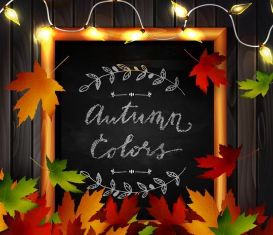 Chalkboard frame with autumn leaves and wooden background 07
