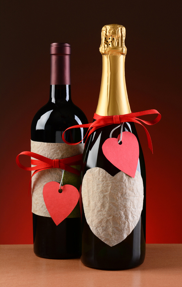 A heart-shaped decoration on a wine bottle