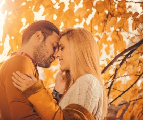 Autumn sun kissing couple Stock Photo