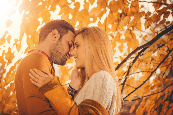Autumn sun kissing couple Stock Photo