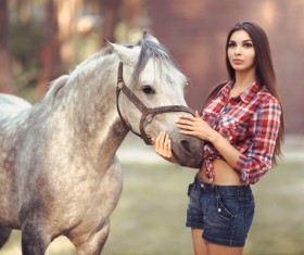 Beautiful girl with gray horse