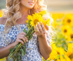 Beautiful girl with sunflowers Stock Photo 01