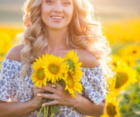 Beautiful girl with sunflowers Stock Photo 02