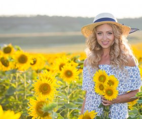 Beautiful girl with sunflowers Stock Photo 04