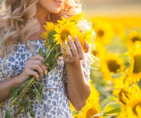 Beautiful girl with sunflowers Stock Photo 05