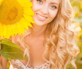 Beautiful girl with sunflowers Stock Photo 09