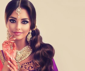 Beautiful stylish Indian woman with red Henna tattoo and beautiful jewelry HD picture