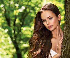 Beautiful woman with trees Stock Photo