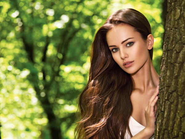 Beautiful woman with trees Stock Photo