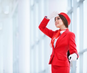Beautiful young stewardess with a white background HD picture