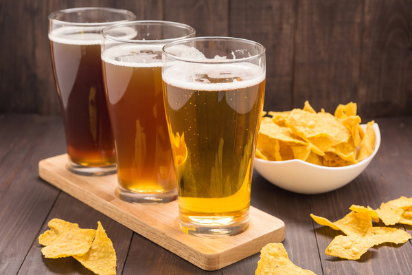Beer and chips on tray Stock Photo