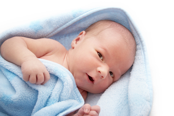 Blanket wrapped in cute newborn baby Stock Photo