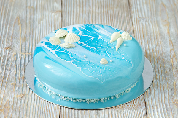 Blue sea shells and top of cake