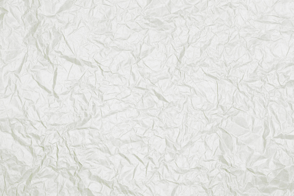 Brightly wrinkled white paper texture background