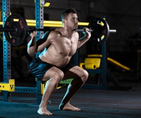Carrying a barbell exercise gym male HD picture