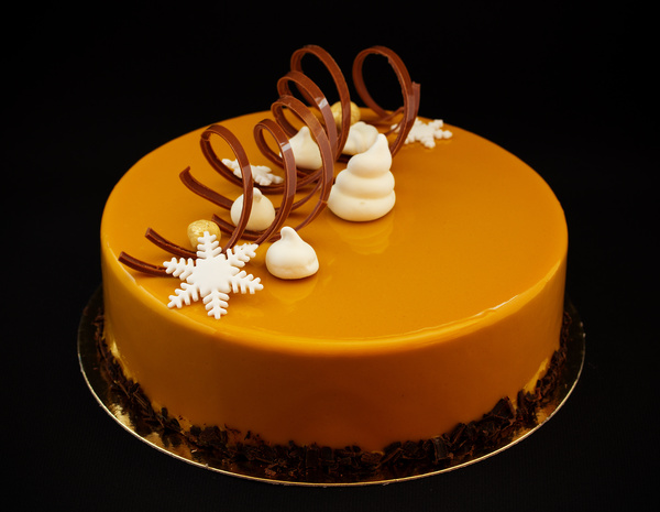 Chocolate lace with golden cake and ornament