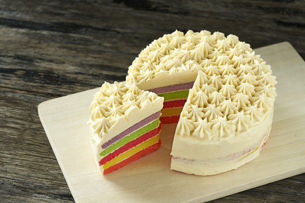 Cut rainbow layer cake