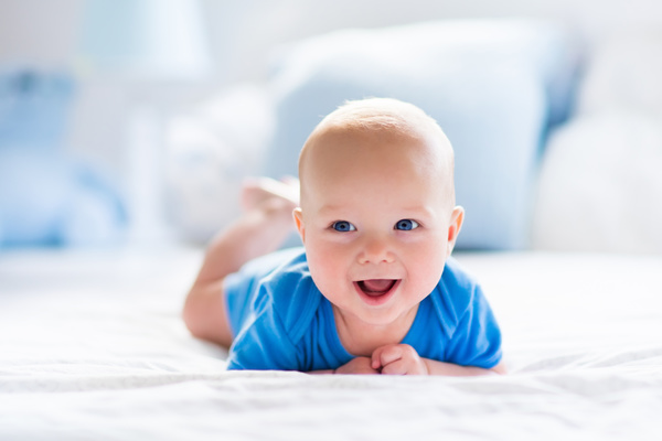 Cute baby in the white sun bedroom Stock Photo