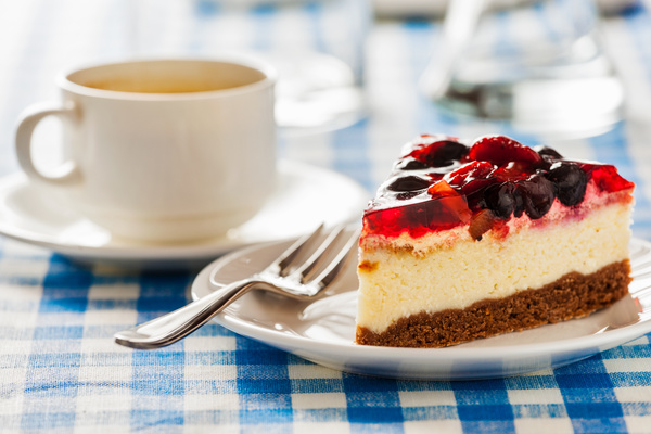 Delicious cheesecake on the table with coffee