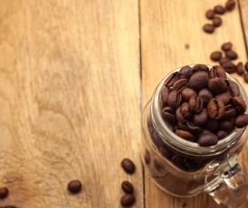 Desktop glass container with coffee beans Photo