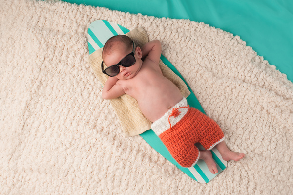 Dress up the cool baby lying on the water board