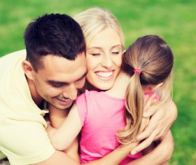 Embracing wife with children and green background