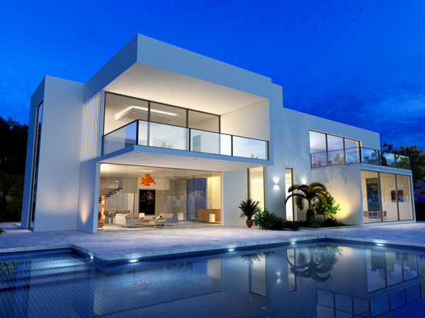 External view of a contemporary house with pool at dusk Stock Photo