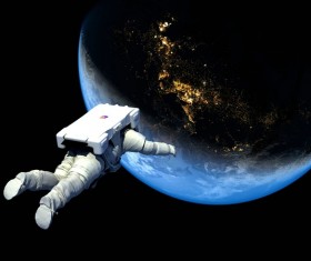 Floating astronauts fly to Earth Stock Photo