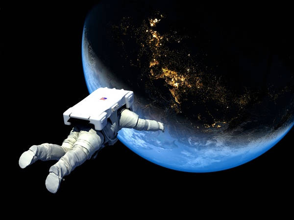 Floating astronauts fly to Earth Stock Photo