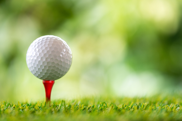Golf ball with green background