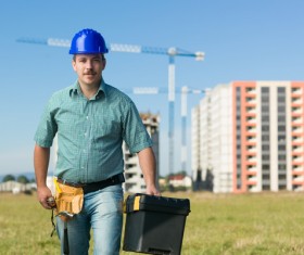 Hand toolbox Construction worker with building crane background