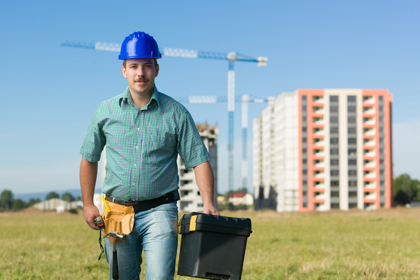 Hand toolbox Construction worker with building crane background