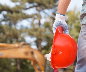 Holding a red helmet with blurred background