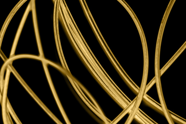 Intertwined gold lines and a black background 02