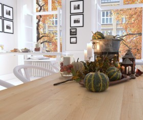 Kitchen with pumpkin on the table and views out the window
