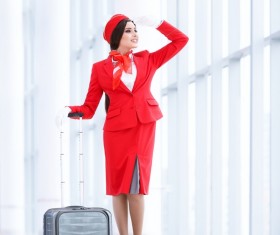 Looking out the window of the stewardess and suitcase Stock Photo