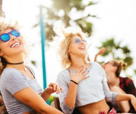 Looking up at the sky Happy smiling three beautiful girls