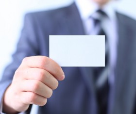 People holding a blank business card with background blur 01