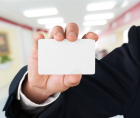 People holding a blank business card with background blur 02