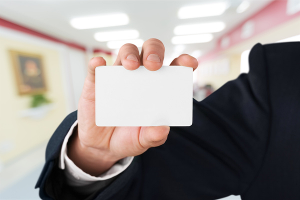 People holding a blank business card with background blur 02