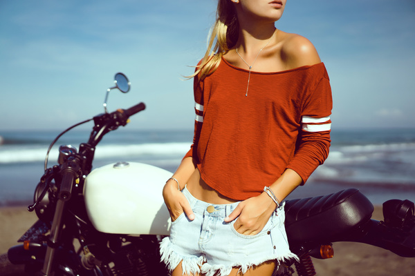 Pretty hipster girl with motorbike stock photo